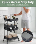 3 Tier Foldable Rolling Cart With Wheels Grab-And-Go Space Saving Utility Organizer Collapsible Metal Storage Cart With 3 Hanging Cups And 6 Hooks For Kitchen Office Nursery Black in bathroom setting