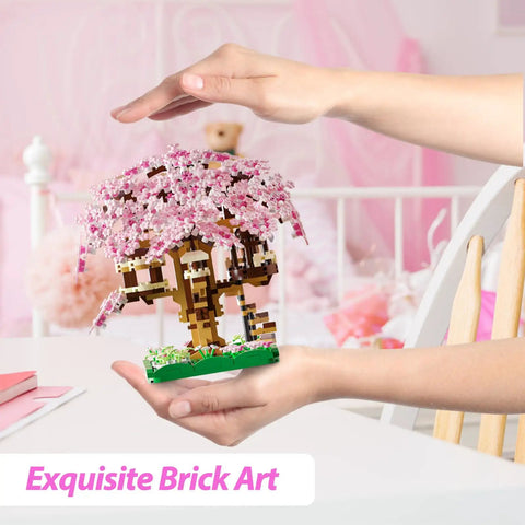 Totally Pink Cherry Blossom Tree Building Set 1113 Pieces For Adults And Kids Sakura Tree House Mini Blocks Kit in hands