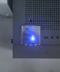 Close-up of Two Pack Power Button Cover 55mm Dustproof Switch Protector with Double Sided Tape on computer panel, preventing shutdown.