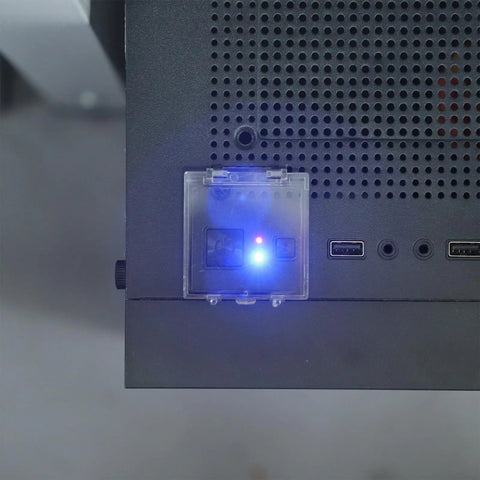 Close-up of Two Pack Power Button Cover 55mm Dustproof Switch Protector with Double Sided Tape on computer panel, preventing shutdown.