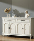 Modern white cabinet with black handles, styled with vases and decor, ideal for living spaces or dining areas.