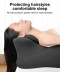 Woman resting on 27 Degree Ergonomic Memory Foam Prone Pillow For Sleeping With Face Down Design Ideal For Stomach Sleepers Aligns Neck And Spine Reduces Back Tension Provides Cozy Bed Reading And Nap Support, grey color, head reclined.