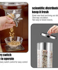 Hand using rotary switch on Triple Head Cereal Dispenser With Spacious Clear Storage Barrel And Rustic Wood Base for easy grain dispensing.