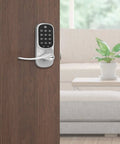 Dead Easy Z Wave Smart Door Lever With Backlit Keypad And Auto Relock For Seamless Home Automation And Top Shelf Satin Nickel Finish on wooden door.