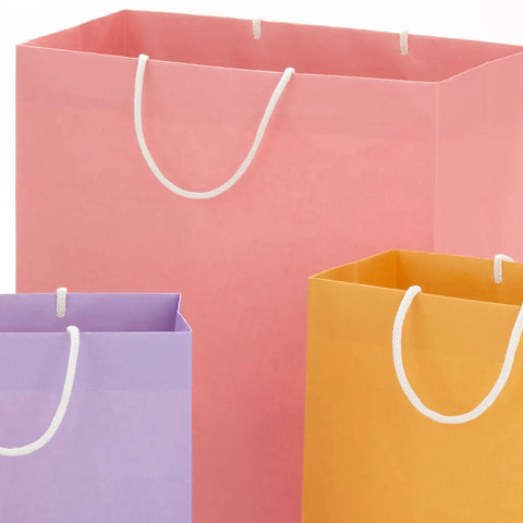 Pastel Color Recyclable Gift Bag Set With Eight Assorted Sizes For All Occasions, close-up of pink, purple, yellow bags with white handles