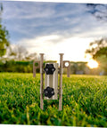 Six-Piece Adjustable Camping Tent Pole Kit with Heavy-Duty Aluminum Stakes on lawn at sunset