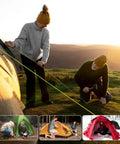 People setting up a tent with Ultralight 7-Inch Aluminum Tent Stakes Set 12 Pack With Reflective Pull Ropes, Tri-Beam Ground Pegs In Carrying Bag, Red
