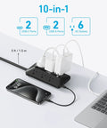 Sleek Power Strip With 300J Surge Protection And 5 Foot Extension Cord Serving Up Pretty Dang Fast Charging Across Six AC Outlets Paired With Dual USB A And Type C Ports For A Smooth No Stress Desk Setup on a desk with devices.