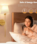 Gold Wireless Wall Sconces Set Of Two With Rechargeable Led Lights Remote Dimmable Switch Ten Adjustable Color Modes Zero Wiring No Fuss Setup Straight Up Game Changer For Cozy Living Room Vibes, installed beside bed, creating a warm ambiance.