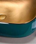 Close-up of a Heavy Duty Rectangular Vessel Sink Installed Above Counter From Porcelain Ceramic with a sleek gold interior.