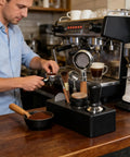Solid Coffee Tamper Holder Built From Shock Absorbent Abs Material For No Fuss Daily Brewing Portable Countertop Tamping Station with tools on a barista's counter.