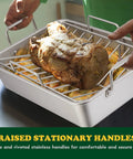 Person holding Stainless Steel Roasting Pan With V-Shaped and Flat Rack for Even Browning, showcasing large roast in pan