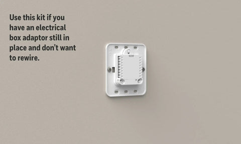 Large Cover Plate And Electrical Box Adaptor For T Series Thermostats on wall, showing mounting holes and compatibility instructions
