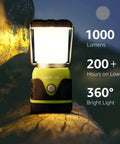 1000 Lumen Battery Powered LED Camping Lantern With Four Light Modes glowing on a log, highlighting 1000 lumens, 200 hours use