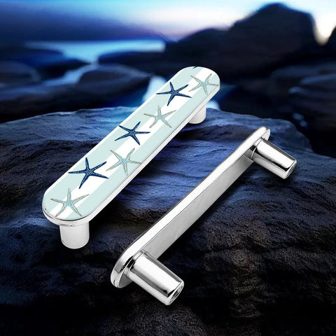 Blue Starfish Cabinet Pulls 4 Pack Center To Center Three Quarter Inch Silver Nautical Drawer Handles on rocks