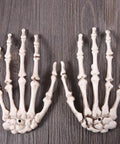 Six Pack Halloween Skeleton Hands Set Realistic Plastic Skeleton Hands for Spooky Decor Right and Left Hands detail on wood surface