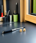 Four Pcs Brass Furniture Stabilizer Legs With Dope Modern Design And 10mm Decorative Riser Feet next to a screwdriver on a desk.