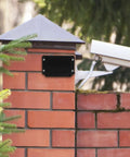 Durable Waterproof Outdoor Electrical Box Plastic Enclosure With Fixed Ear 115x90x55mm Black mounted on brick wall outside