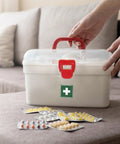 Milton white plastic first aid box set of 2 with red handle and latch, transparent lid (front view).
