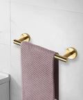 Heavy Duty Stainless Steel Towel Bar Wall Mount Rack For Bathroom And Outdoors, Rustproof 304 Stainless With Matte Black And Gold Finish, 24 Inch Overall Length, 21 Inch Usable Hanging Space, One Pack in gold on wall.
