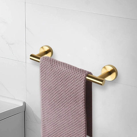Heavy Duty Stainless Steel Towel Bar Wall Mount Rack For Bathroom And Outdoors, Rustproof 304 Stainless With Matte Black And Gold Finish, 24 Inch Overall Length, 21 Inch Usable Hanging Space, One Pack in gold on wall.