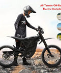 Badass Electric Dirt Bike For Adults Teens, 8000W Brushless Motor Ebike With 60V Dual Battery, side view of black electric dirt bike on rugged terrain.