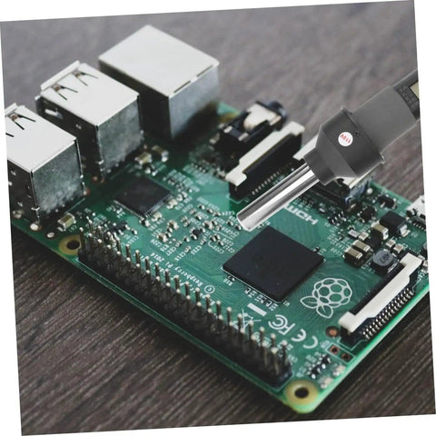 110V LCD Display Soldering Station And Portable Hot Air Gun for desoldering on a small PCB with adjustable temperature feature