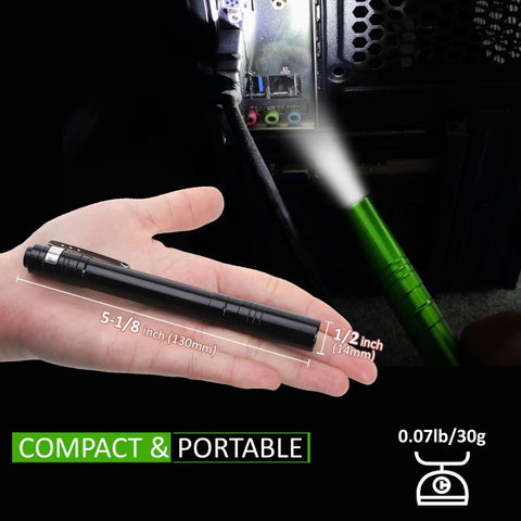 15-Pack LED Penlight Set With Clip in hand, with light beam directed at camping equipment, showing compact and portable size.