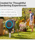 Automatic Retractable Garden Hose Reel With 66 Feet Reach 360 Degree Swivel Metal Spike Base Easy Install No Tool Needed UV Resistant Housing Smooth Auto Rewind And Lock Durable Yard Hose Organizer in garden with man watering flowers