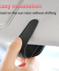Heavy Duty Magnetic Sunglass Holder For Car Sun Visor With Secure Snap Clip And Soft Leather Wrap One Handed Eyewear Organizer showing easy installation on sun visor.