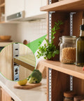 Close-up of Heavy Duty 17 Inch Pilaster Shelf Brackets Set Of 8 Adjustable Mortise Wall Rails featuring galvanized steel, mounted in a kitchen.