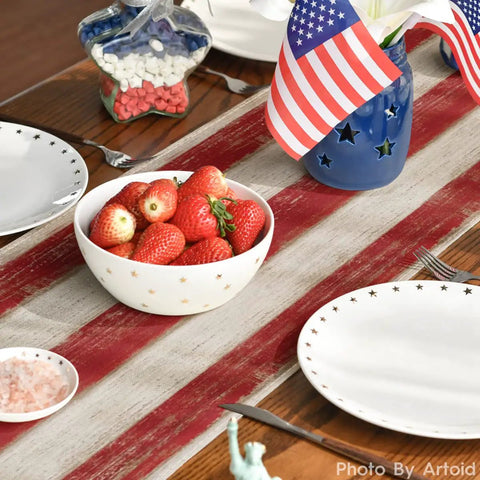 American Flag Table Runner 13x72 Inch For 4th Of July Memorial Day Kitchen Dining Decor Durable Spun Polyester Party Ready Tablescape With Stars And Stripes Theme For Home Parties And Seasonal Decor, showcasing a festive setup with strawberries and flags.