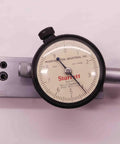 Adjust-O-Matic Micro Flote Gauge.0001 Inch Graduation With.025 Inch Range, US Made Pro Grade Precision Measuring Tool For Machinists, Metalworkers, And DIY Enthusiasts, Easy Readout, Rugged Build, Perfect For Tight Tolerances. dial gauge on metal block