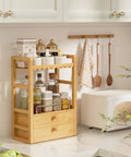 Bamboo Bathroom Countertop Organizer With 2 Tier Makeup Storage And 2 Drawers, holds bottles and jars, kitchen setting.