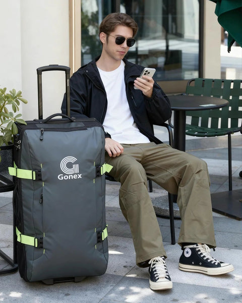 Gonex 30-inch rolling duffle bag, gray nylon with lime-green straps, front view with wheels and telescoping handle