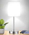 Must Have Dope Fully Dimmable Table Lamp With USB Ports And AC Outlet beside plant and tablet on desk
