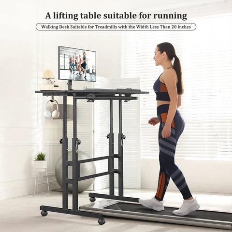 Woman using rolling standing desk on wheels with height adjustment, watching monitor while on a treadmill in home office