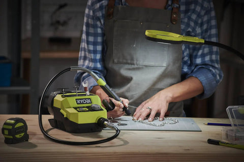 Badass 18 Volt Cordless Mini Rotary Tool With 35 Premium Accessories For Ultra Fast Diy Engraving Polishing And Precision Sanding Projects in use on a crafting table.