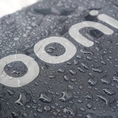 Close-up of Karu 12 And Karu 2 Carry Cover Waterproof Weatherproof Shield showing waterproof droplets on fabric