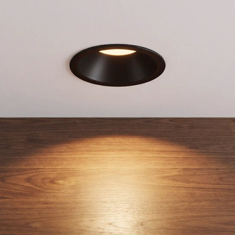 Operitacx Black Metal MR16 Downlight Housing, Fits 1.57" Cut-Out, 3.3" OD, installed in ceiling with warm spotlight illumination.