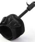Close-up of black Third Gen Compound Bow Release With 360 Degree Rotatable Wrist Ambidextrous Archery Release With Adjustable Thumb Trigger