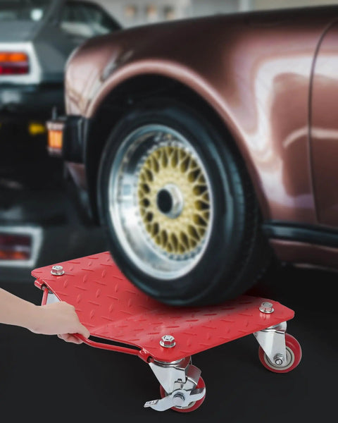 Heavy Duty Carbon Steel Tire Wheel Dollies Set Of 4 Car Movers With Anti Skid Plate And 360 Degree Rotating Wheels 16 By 13 Inches Red Each Supports Up To 1500 Lbs placed under a car wheel.