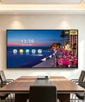 65 Inch 4K UHD Interactive Touch Monitor With Smooth Gliding Rolling Cart Stand Featuring Dual Operating Systems And Eye Relief Matte Anti Glare Ips Display For Classrooms Office Spaces And Home Theater in a conference room.