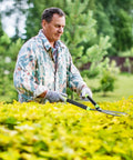 Man using Heavy Duty Telescoping Hedge Shears 23 To 30 Inches With 20 Degree Angled Head Rust Proof Carbon Steel Blades