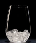 Badass Commercial Cubelet Ice Machine Featuring Efficient Air Cooled Design And Generous Built In Storage Bin Cranks Out 300 Pounds Daily Of Smooth Nugget Ice For Busy Restaurants filled glass with nugget ice cubes, against black background.
