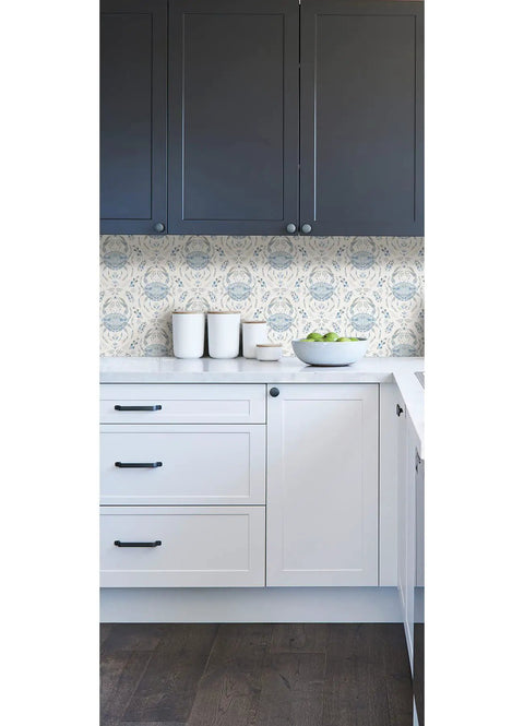 Kitchen with Blue Shellby Peel And Stick Wallpaper With Coastal Crab Damask Print above white cabinets, seamless DIY install.