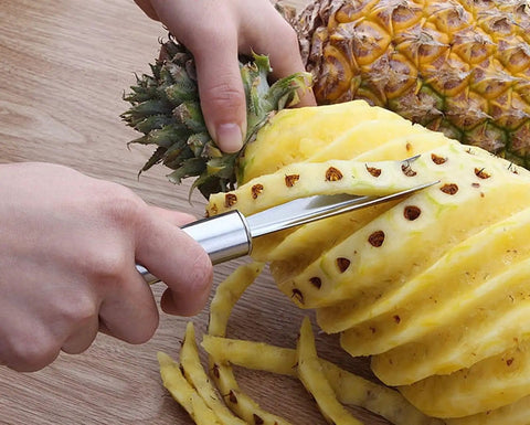 Using Pro Grade Stainless Steel Pineapple Eye Remover Tool With V Shaped Cutter to peel pineapple