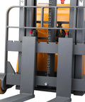 Heavy Duty 2200 Lb Counterbalanced Electric Pallet Stackers With Full Mast And Straddle Forks Reaching 98 Inches High base view showing straddle forks and lifting mechanism.
