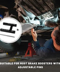 Hella Tight Brake Booster Adjustment Tool With Magnetic Aluminum Body And Adjustable Pin For Master Cylinder Push Rod Length Gauge used by mechanic under vehicle