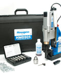 Hardcore 115 Volt Magnetic Drill Machine With Integrated Coolant Reservoir Half Inch Chuck Adapter And Rotary Cutter Kit Knockout Shop Workhorse For Tough Steel Fabrication And Precision Machining Jobs, portable model HMD905 with cutting tools and case.